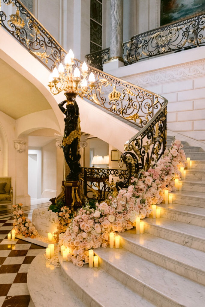 Elegant candlelit staircase design at Shangri-La Paris for a luxury destination wedding in France Remi Dupac Phtotography