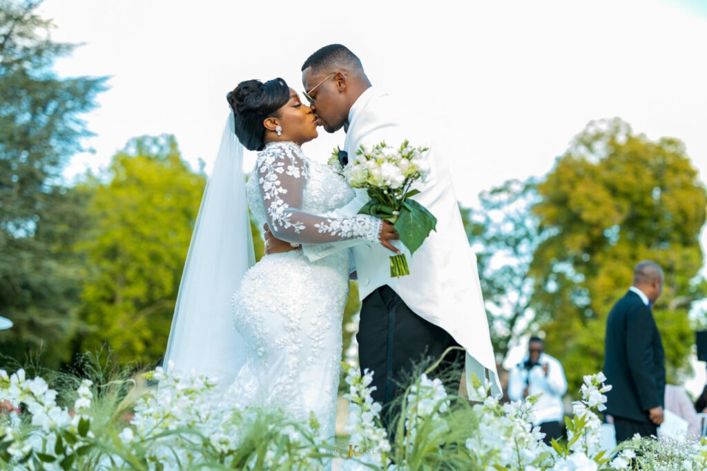 bride and groom kiss at the ceremony
